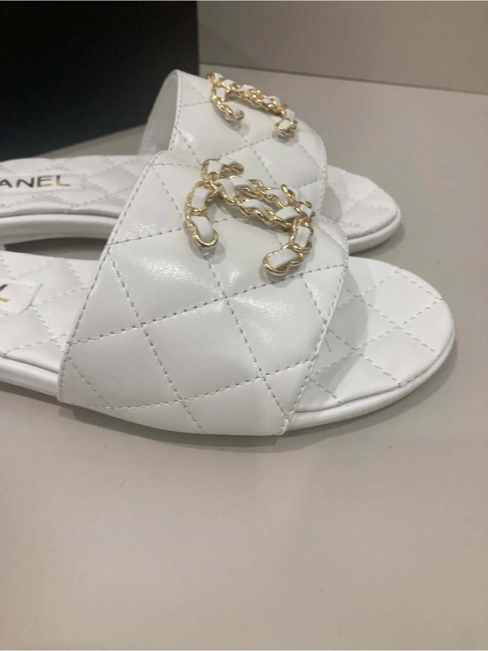 CHANEL White Quilted Slide Mules with Gold CC Chain Logo